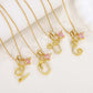 Collier avec initiale et breloque cœur rose
